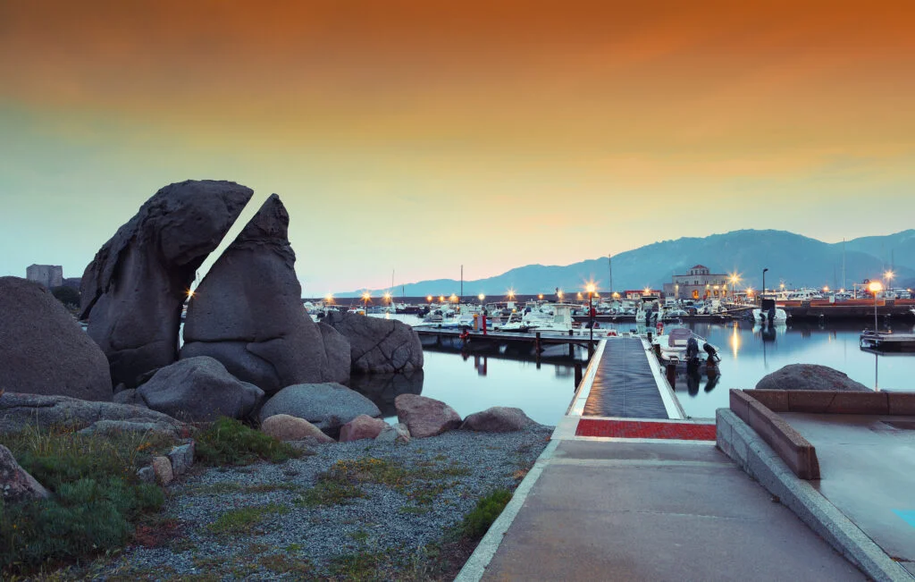 fantastic sunset view of boats in beautiful marina villasimius