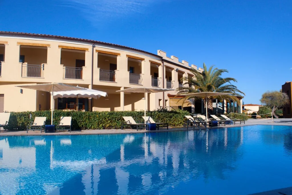 huge swimming pool near the hotel in a resort in San Teodoro