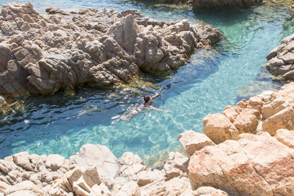july 23 2021 girl dive into the clear waters cala liberotto